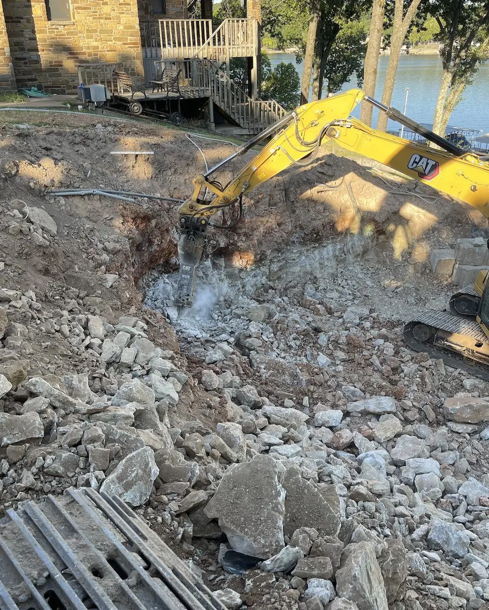 Concrete slab broken out with a hydraulic hammer